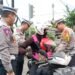 Mudik Aman, Satlantas Polresta Bogor Kota Bagikan Sabuk Keselamatan Anak